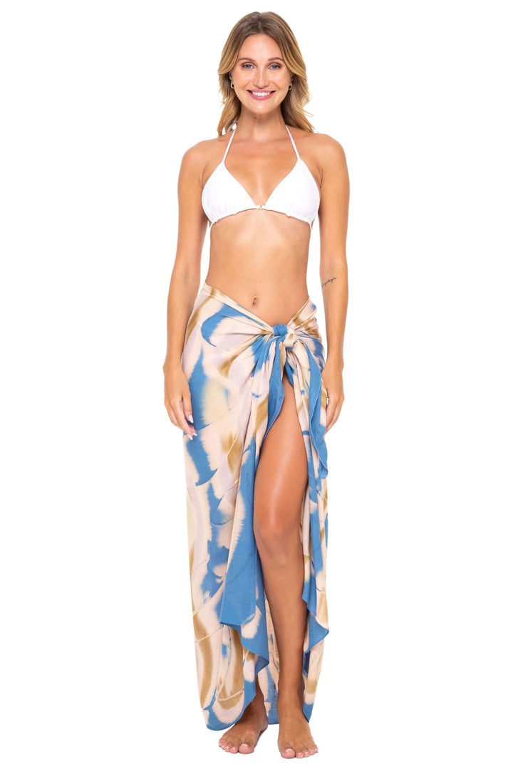 Woman wearing a black bikini and a blue jeans Tie-Dye Sarong Wrap Cover-Up for Women by SHU-SHI, styled as a long wrap skirt. Lightweight rayon beach cover-up, perfect for vacations, poolside lounging, tropical beach getaways, cruises, and resort wear.