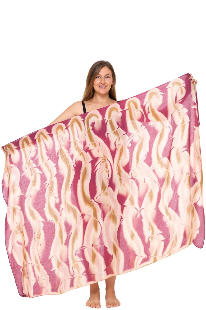 Woman wearing a black bikini and a burgundy  Tie-Dye Sarong Wrap Cover-Up for Women by SHU-SHI.  Lightweight rayon beach cover-up, perfect for vacations, poolside lounging, tropical beach getaways, cruises, and resort wear.